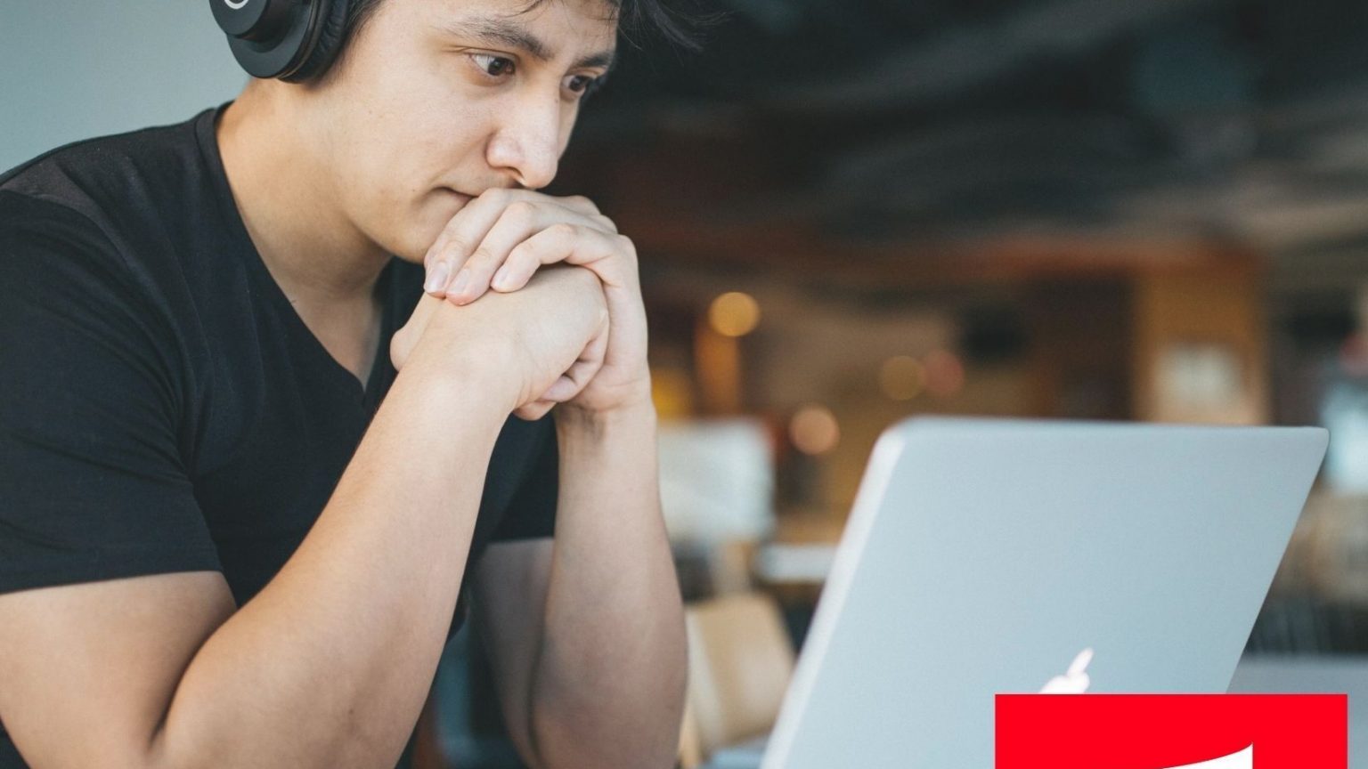 man with headphones at computer