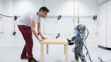 Robot playing with human and table