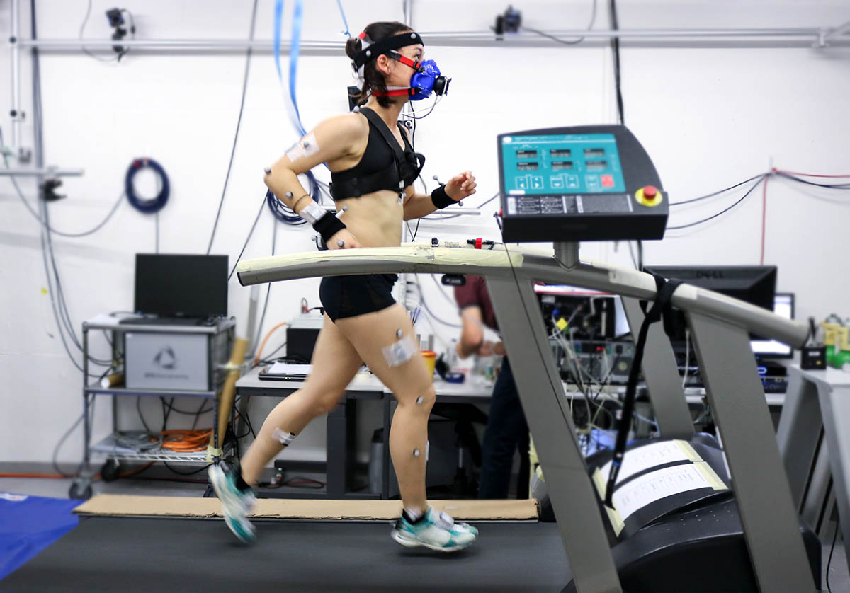 Athlete running on a treadmill equipped with all the instrumentation