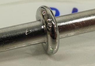 A metallic glass specimen that underwent a compression test