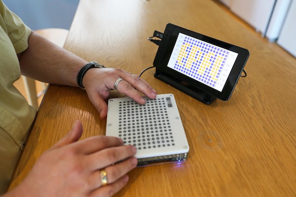Denis Maret using haptic tablet. photo (C) EPFL Muriel Richard
