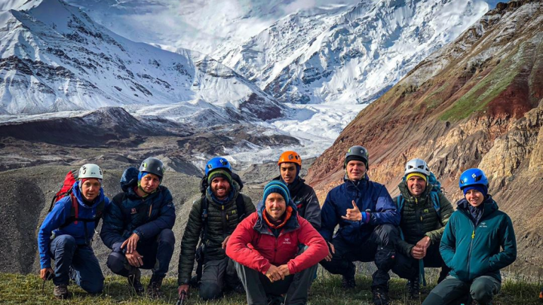 Fieldwork below the emblematic Pic Lenin, along with our support team. Despite the worrisome faces, this was the only day that we escaped the storm and were not drenched (Photo © Andrey Savinykh)